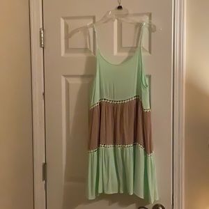 Kori summer dress. Tan and pale green with a little white trim.